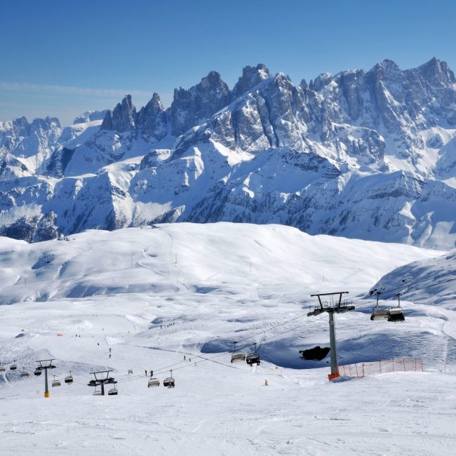 Ski paradise in the Italian Dolomites. Ski lift, piste, slopes in the Alps